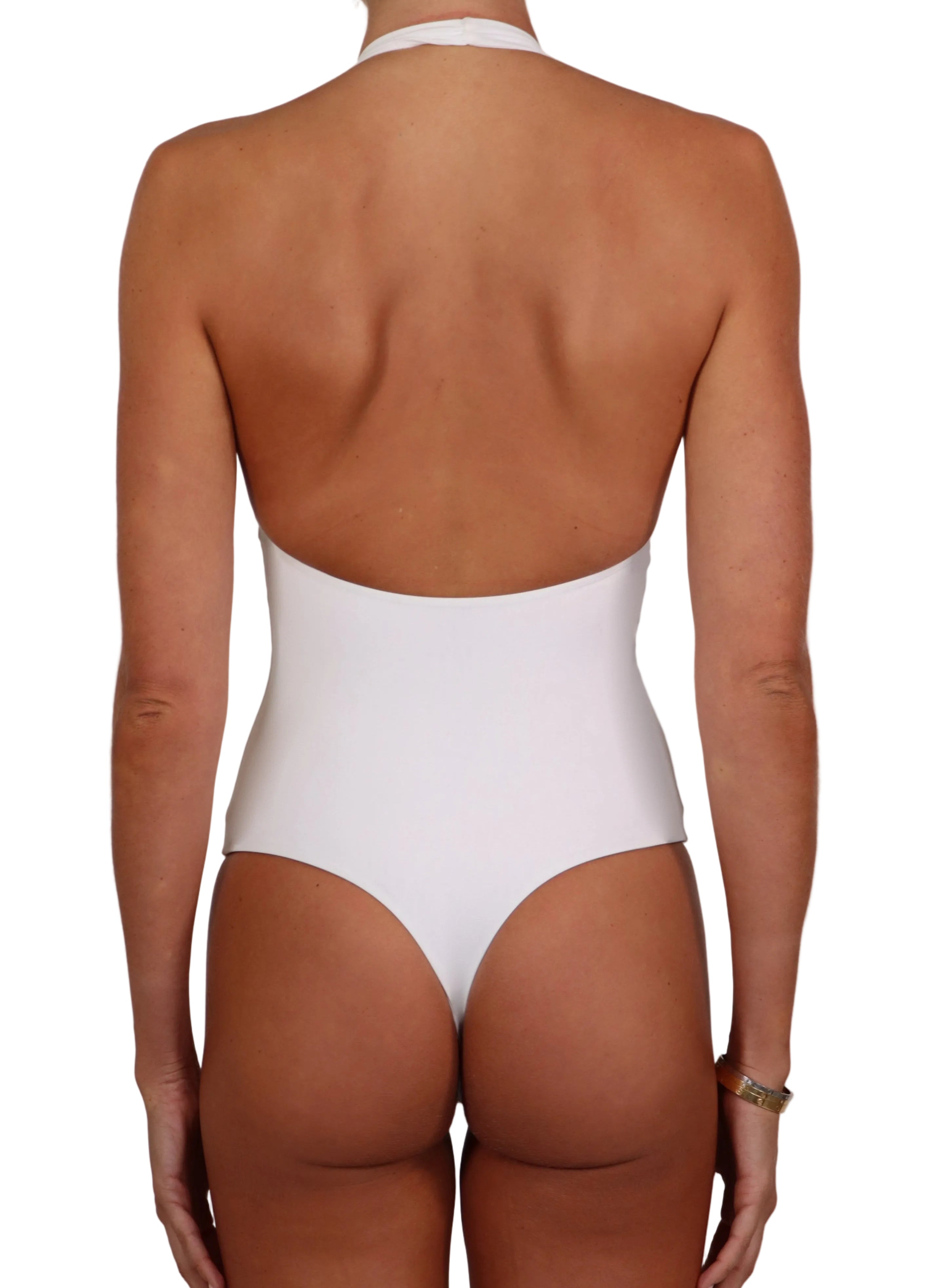 Person wearing a white swimsuit against a neutral background dailora halter neck open back 